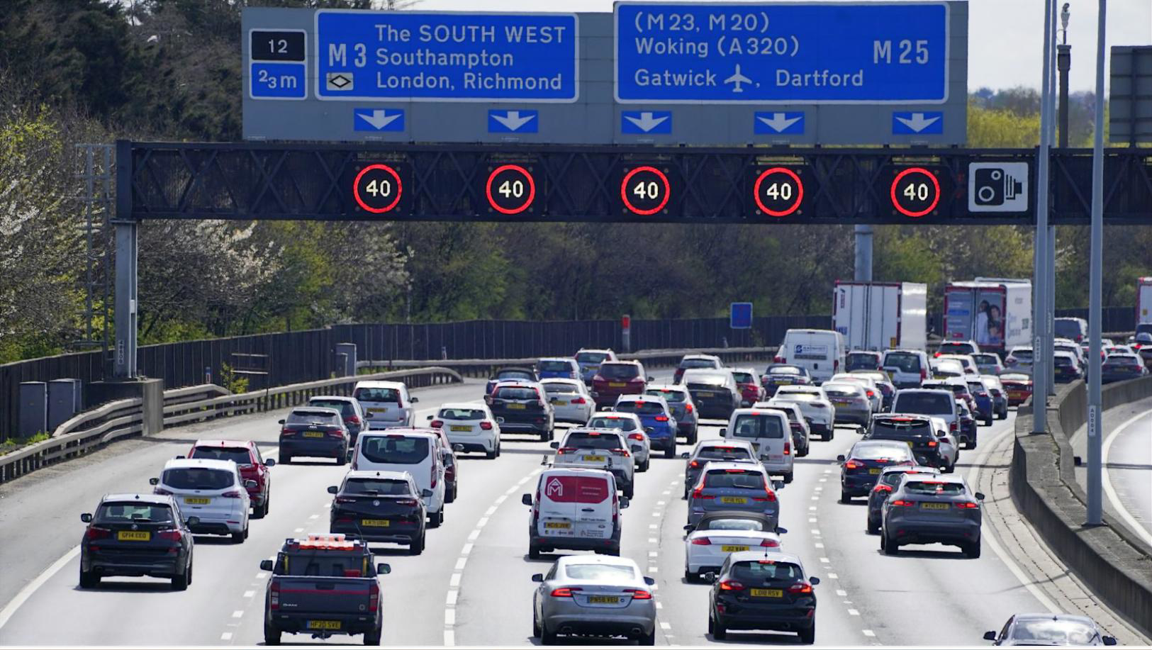 Busy motorway with overhead signs